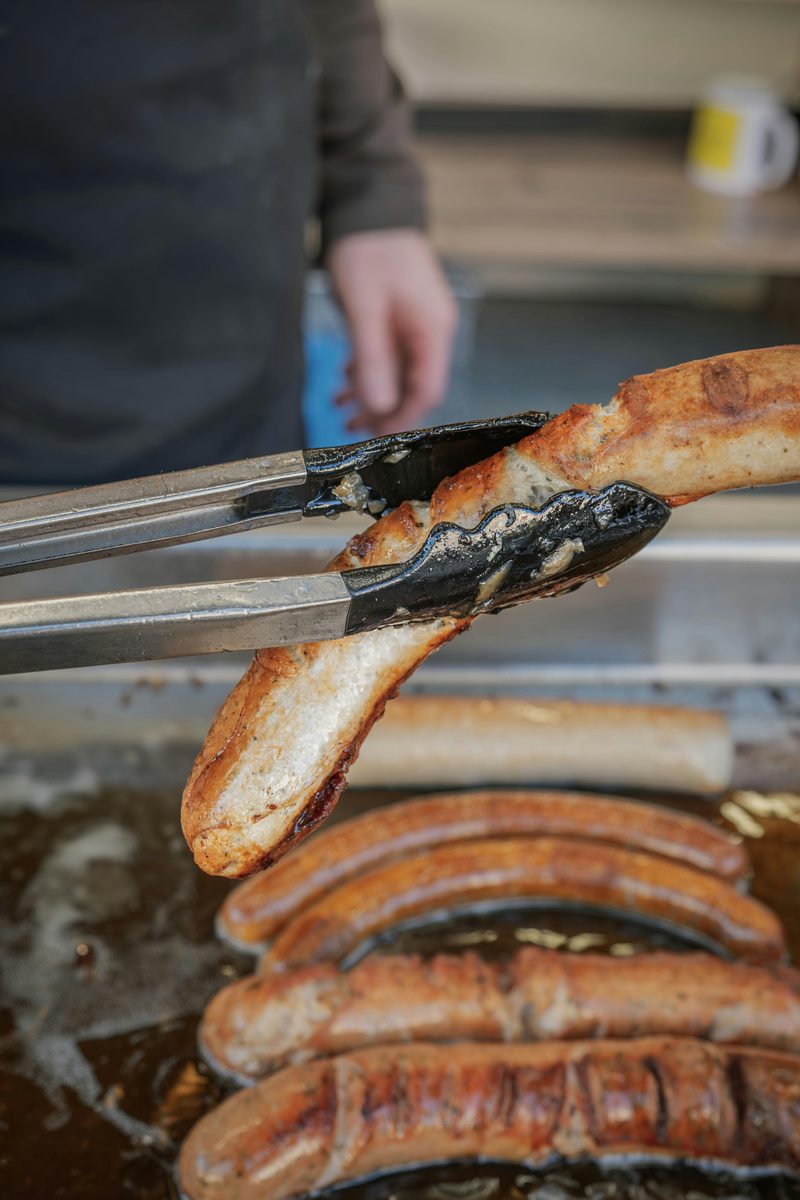Sausages cooking on a garden barbecue