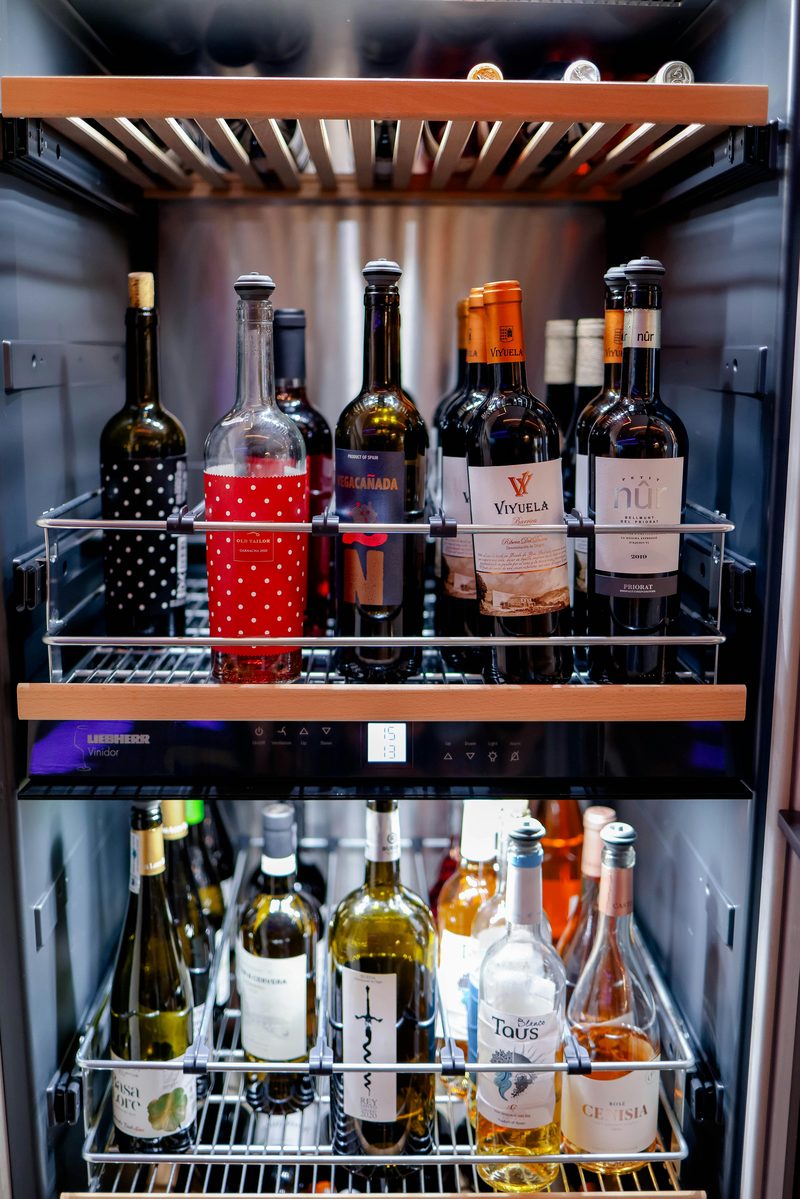 A drinks fridge stocked with bottles