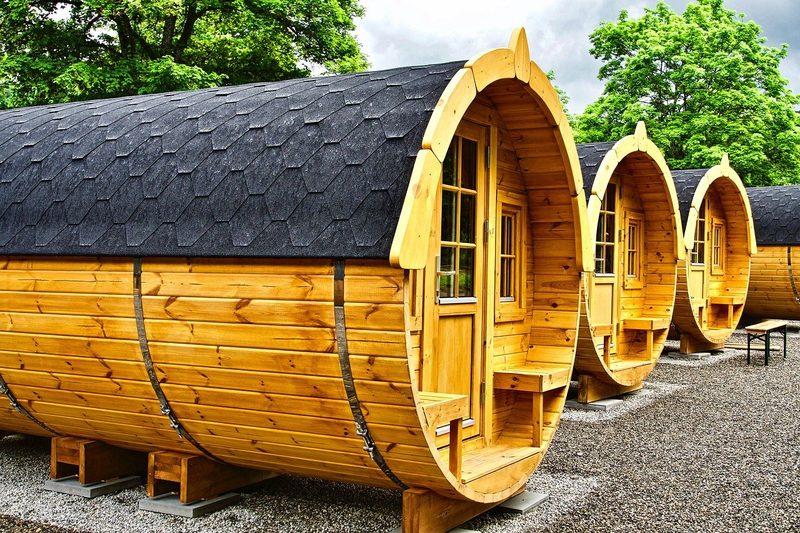 Timber garden pods lined up on gravel