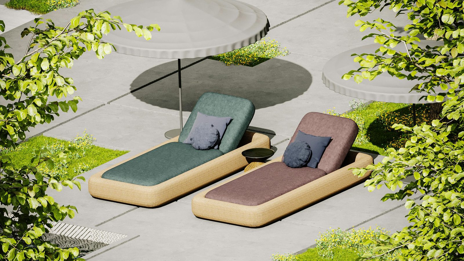 Two sun loungers on a garden terrace beside planting